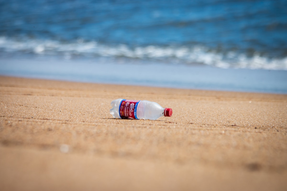 Plastic bottle discarded on a beach shore